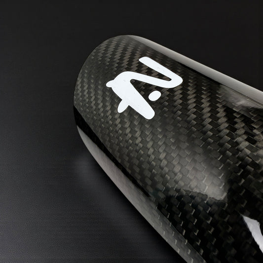 Carbon fiber surface with a white logo on a black background