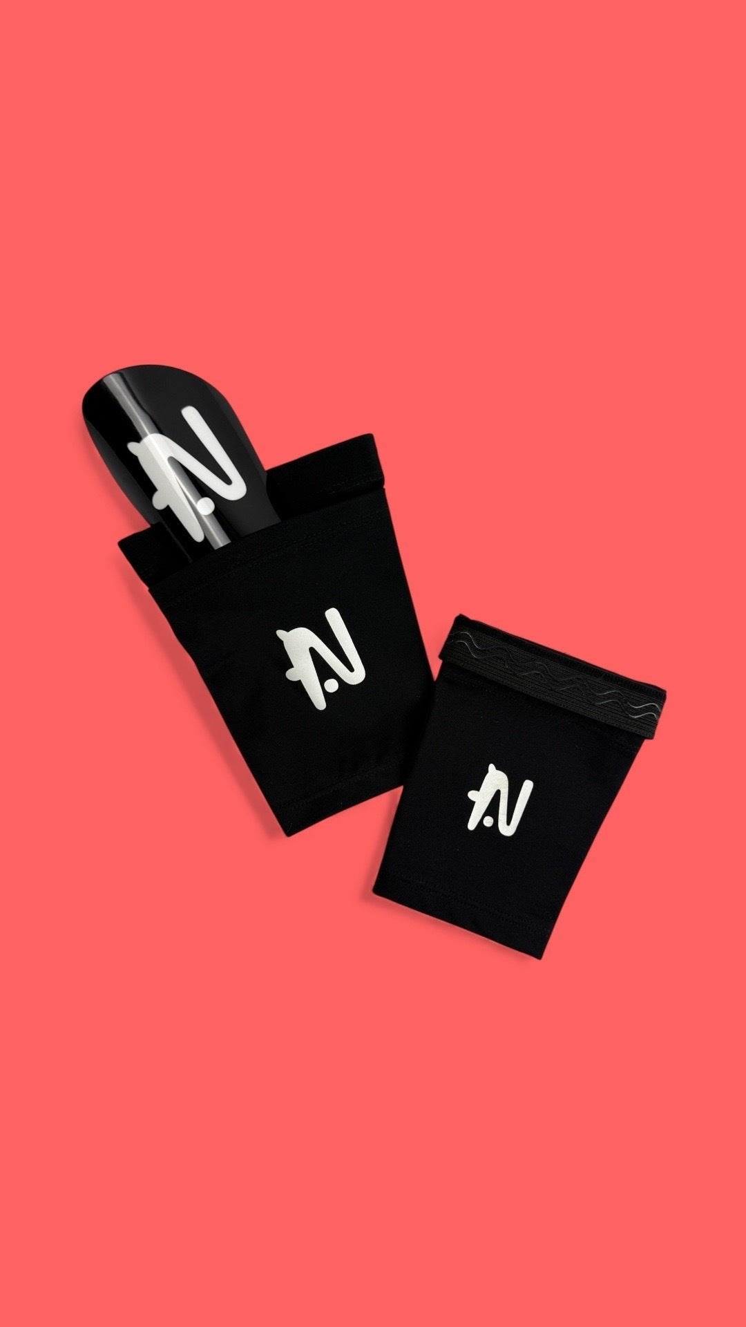 Black NTMG original sleeves with black classic glossy shin guard on tomato coloured background