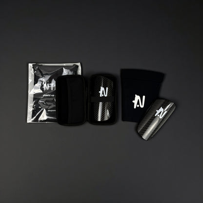 Black and white product set with branded items on a dark background