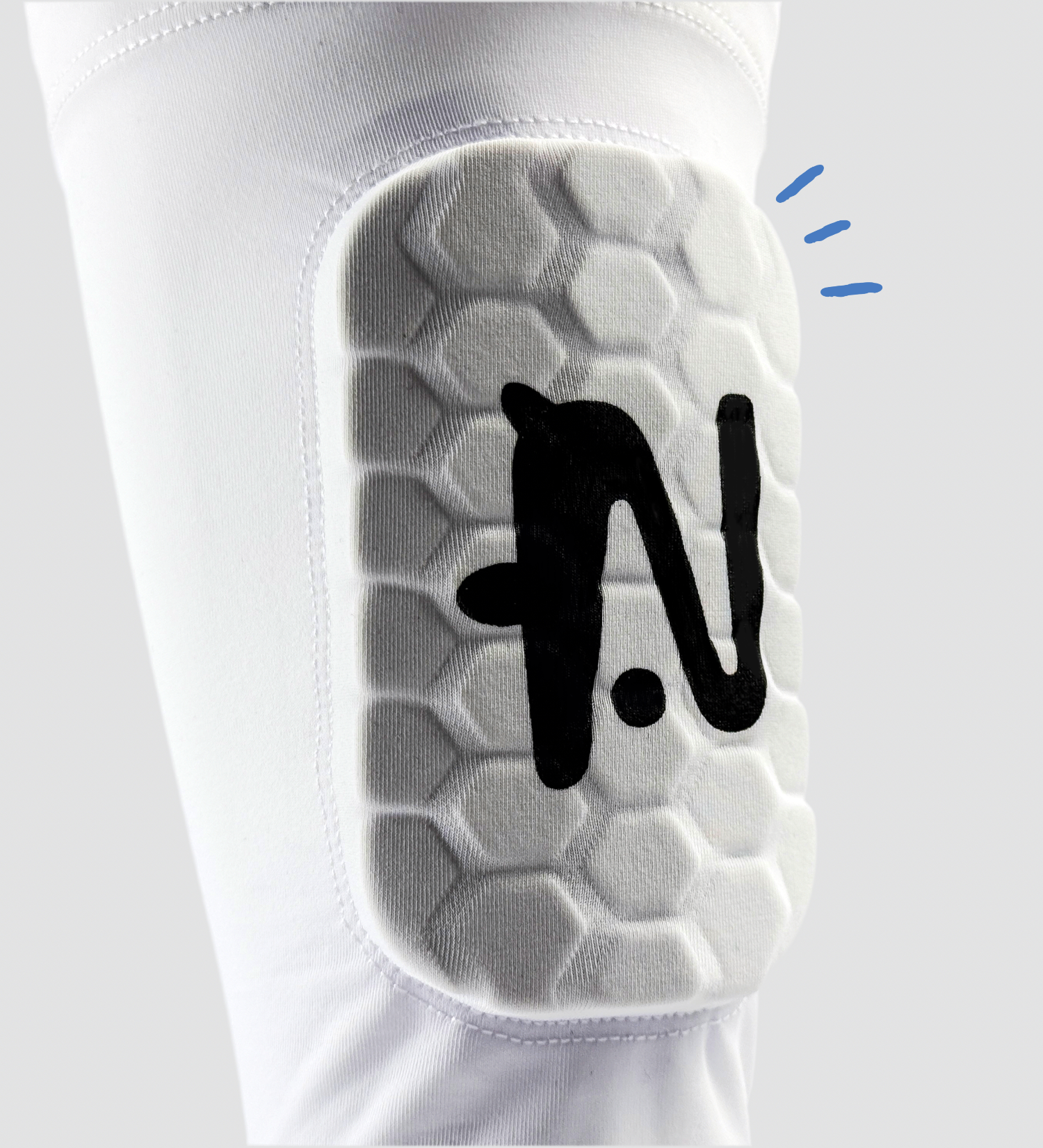 White built in shin pad with honeycomb pattern and black logo on a white background